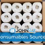 A cardboard box filled with individually wrapped rolls of paper towels
