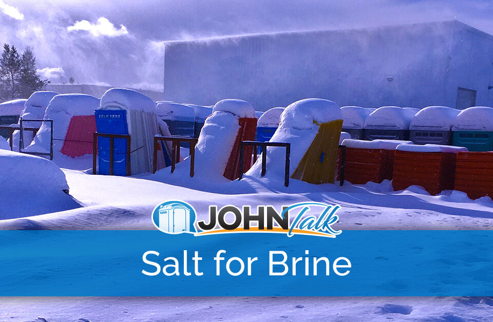 Portable toilets and portable toilet pieces covered in snow