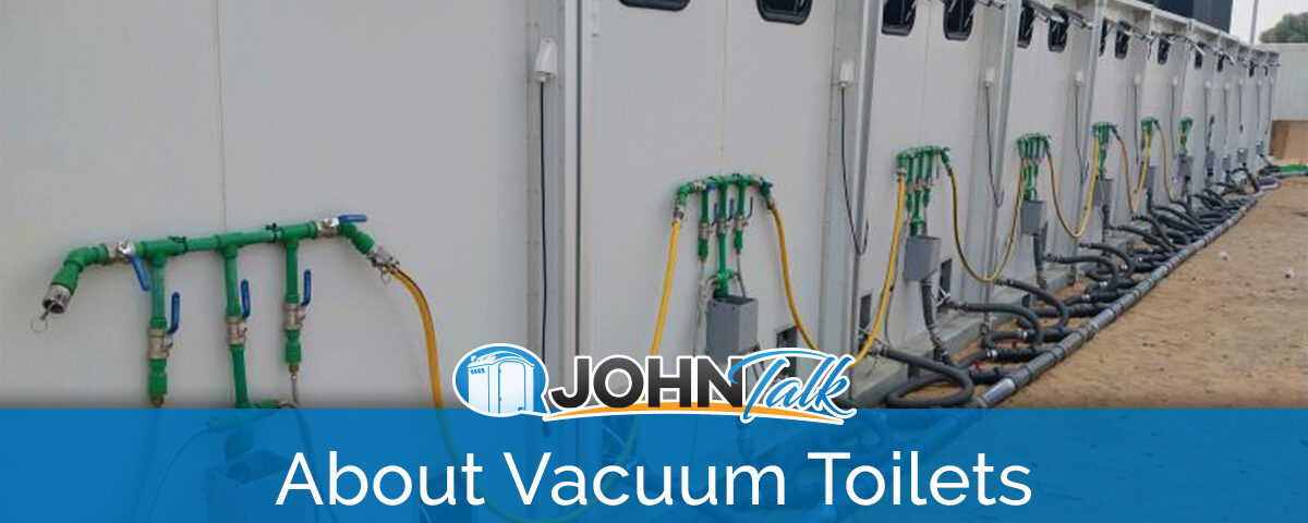 The backs of a row of vacuum toilet systems showing some of the components
