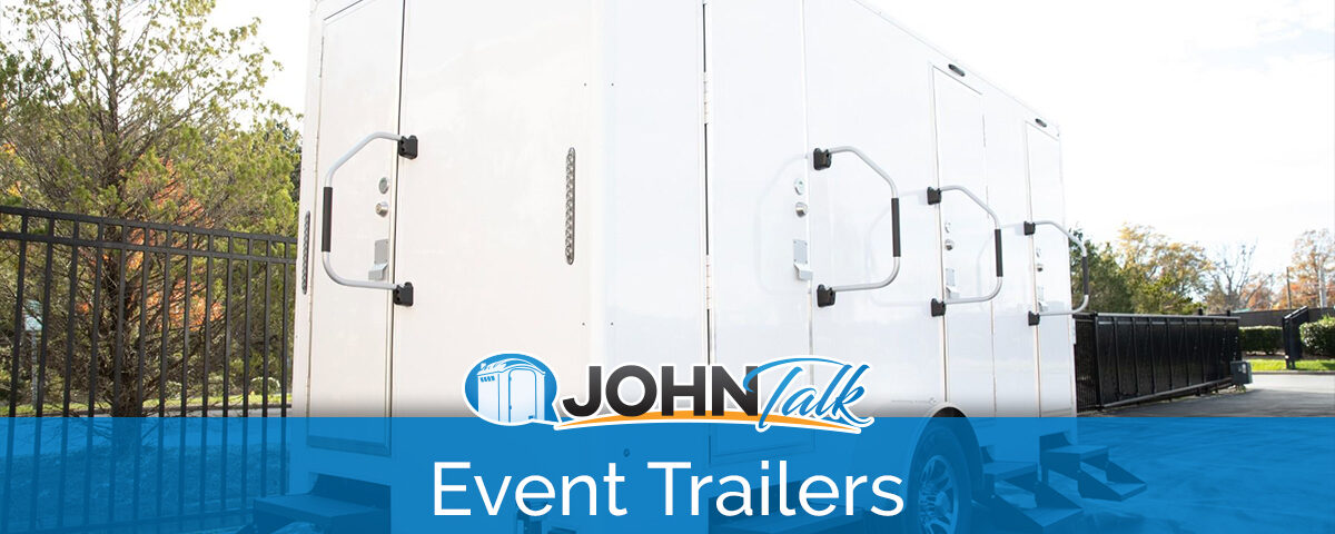 A portable restroom trailer in a parking lot