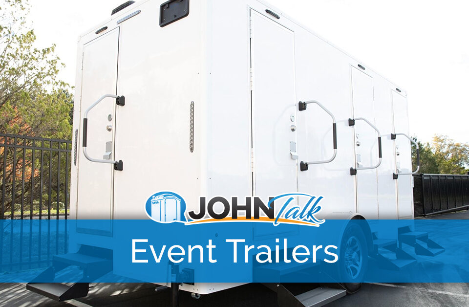 A portable restroom trailer in a parking lot