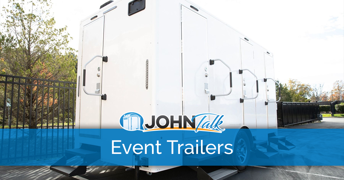 A portable restroom trailer in a parking lot